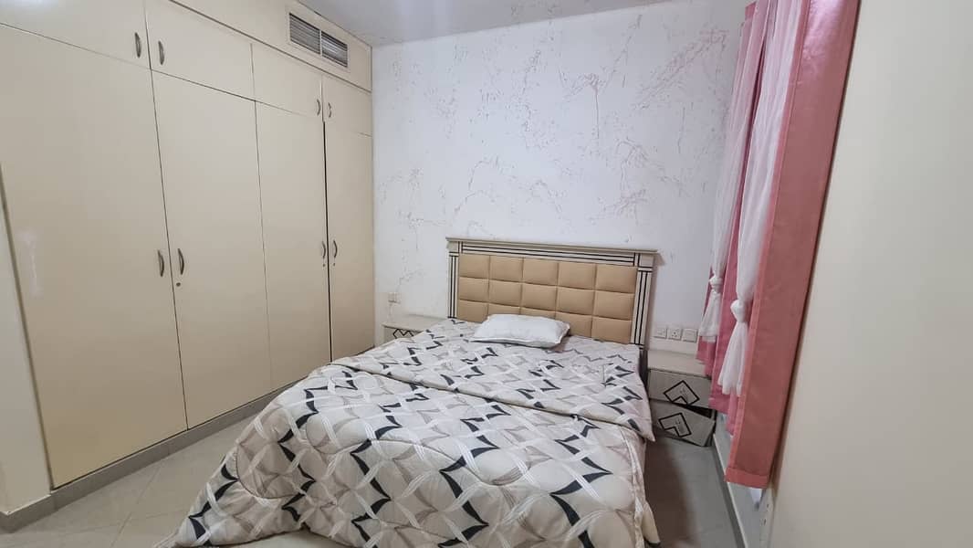 Most luxurious fully furnished one-bedroom apartment with a living room in Al Taawun, furnished to the highest standard / Close to daily amenities