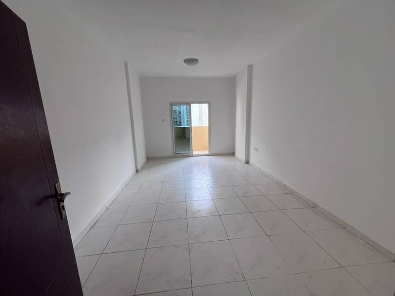 2-bedroom apartment and hall in Al Rashidiya near the Corniche, central AC, separate hall, 2 bathrooms, built-in wardrobes, AED 38,000 in 4 payments,