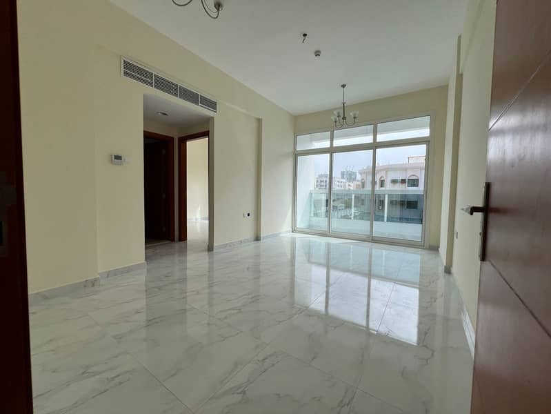 First tenant 2-bedroom apartment and hall in Al Nuaimiya, Kuwait Street, master room, 2 bathrooms, central AC, maintenance by owner, AED 40,000 in 6 p