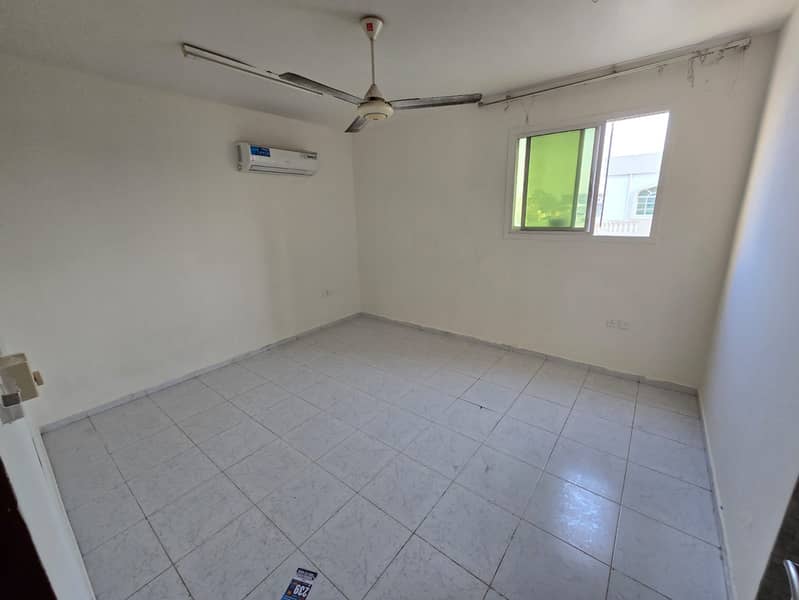 Studio with separate kitchen for annual rent in Al Rawda, Ajman, spacious layout and excellent division, 19,000 AED in 4 installments