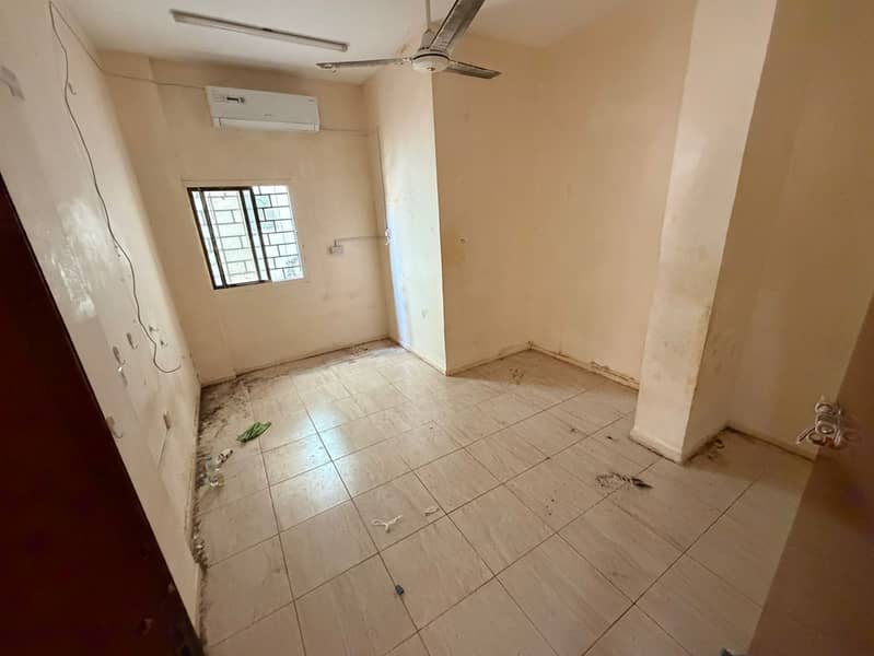 Ground-floor studio with separate kitchen and hallway, large space, Ajman Corniche, AED 20,000 in 6 payments, AED 2,000 cash security, 2 months deferr