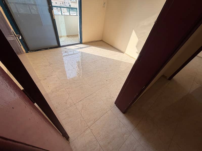 2 bedroom apartment with balcony for rent second row Ajman Corniche AED 35K in 6 payments 2 bathrooms separate living room bright apartment prime loca