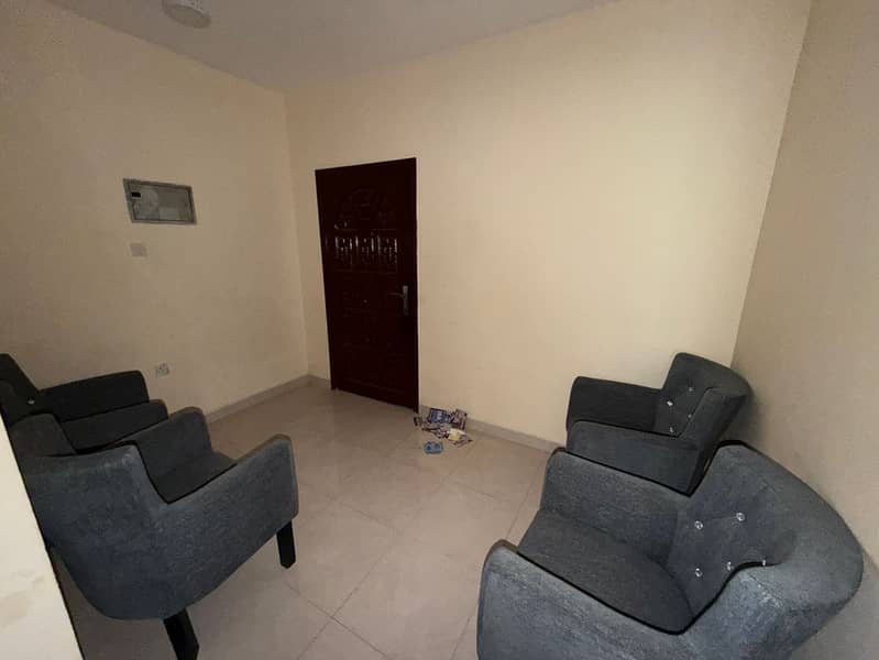 Two-bedroom furnished apartment with a living room for annual rent in Liwara 1, Ajman. Located on the second row from Ajman Corniche