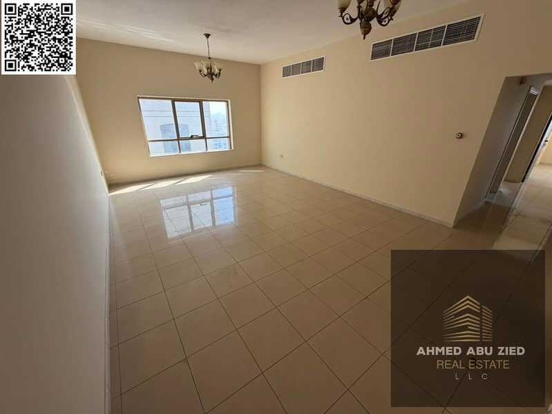 For rent: a two-bedroom apartment in Ajman Corniche, with three bathrooms and two master bedrooms, a balcony with a direct view, a large and bright sp
