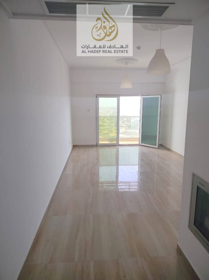 Annual rent in Ajman, Al Nuaimiya 3 area, near Dubai Islamic Bank. Two-bedroom apartment with a living room, balcony, central air conditioning, two ba
