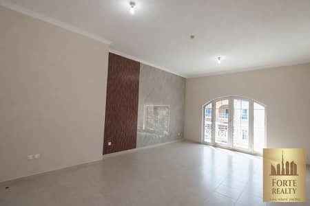 2 Schlafzimmer Wohnung zum zum Verkauf in Dubai Investment Park (DIP), Dubai - Spacious living room with balcony view. png
