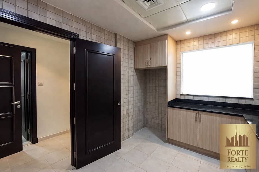 4 Modern kitchen with wooden door. png