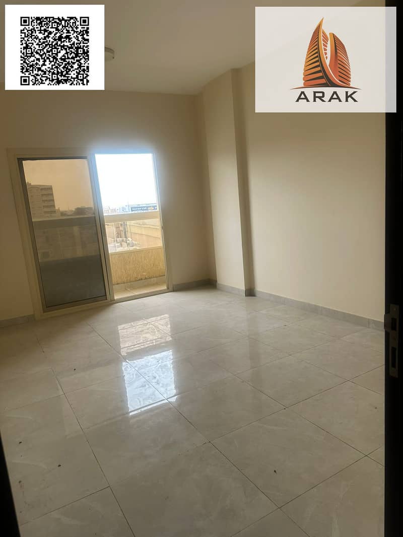 Two-bedroom apartment with a living room, two bathrooms, and a balcony for rent in Al Jurf 2.