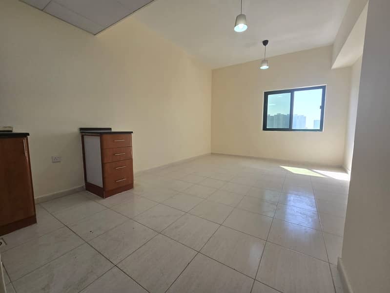 A studio apartment is available for annual rent in Al Rashidiya, Ajman, located in one of the