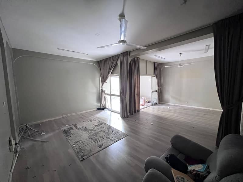 Special offer for annual rent: Two-bedroom apartment with a master living room, ground floor, in Al Rashidiya, prime location near Nesto Hypermarket.
