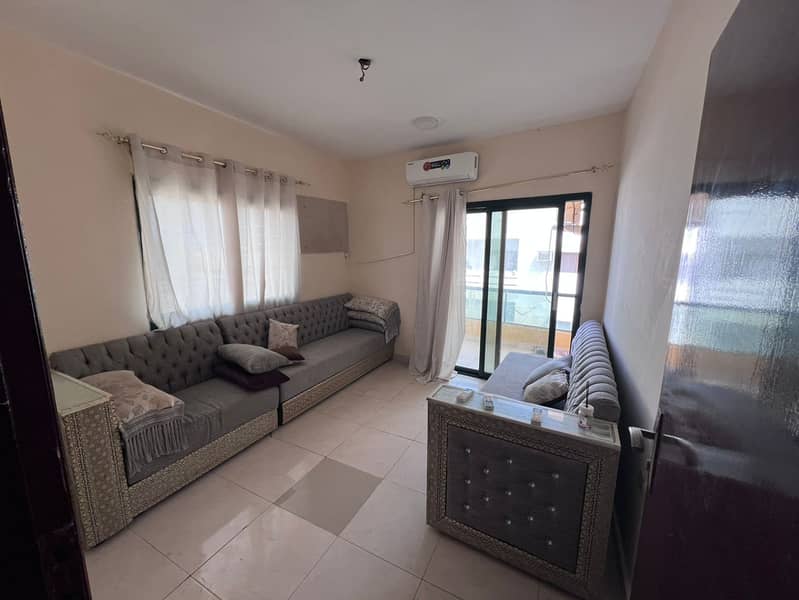 Two bedrooms and a living room for annual rent in Ajman 29,000 AED in 4 installments Furnished included Spacious area, prime location, one bathroom wi