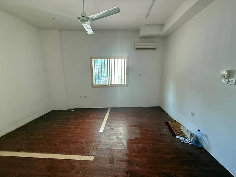Ground floor studio second row from Ajman Corniche spacious layout prime location close to beach services affordable rent ideal living option