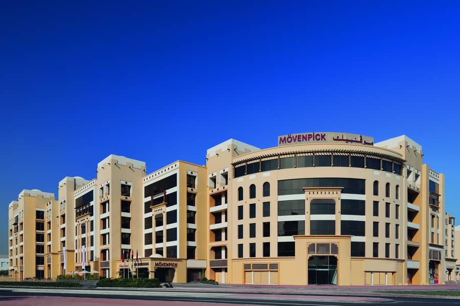 8 Mövenpick Hotel Apartments Al Mamzar - Exterior morning. jpg