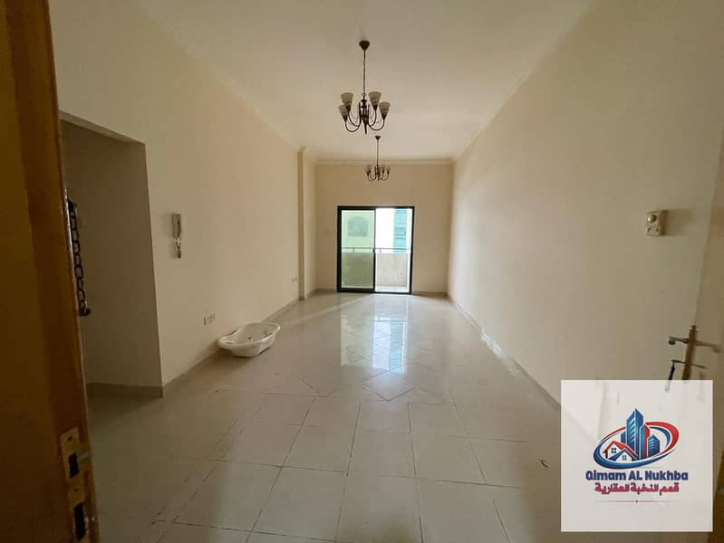 Balcony with open city view – Beautiful and spacious 2-bedroom apartment with a living room in Al Qasimia, Sharjah, featuring an internal privacy hall