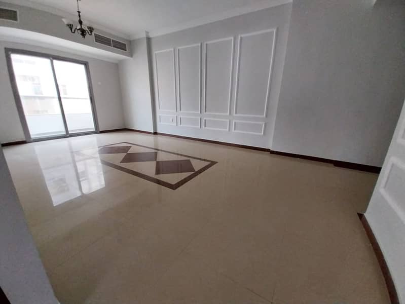 Two-bedroom apartment with a living room for annual rent in Al Nuaimiya 2, Ajman. Two bedrooms, living room, two bathrooms, central air conditioning.