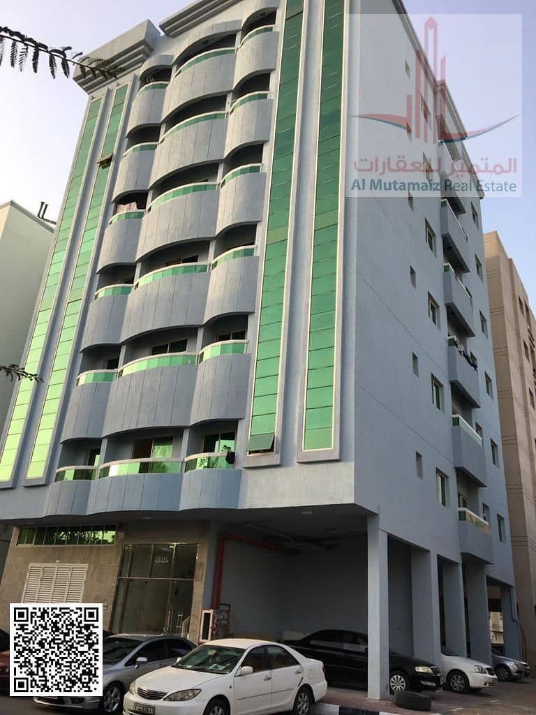 Studio apartment with balcony for annual rent in Ajman, Al Mazroui Building, Al Nuaimiya 2. Rent is AED 18,000, payable in installments