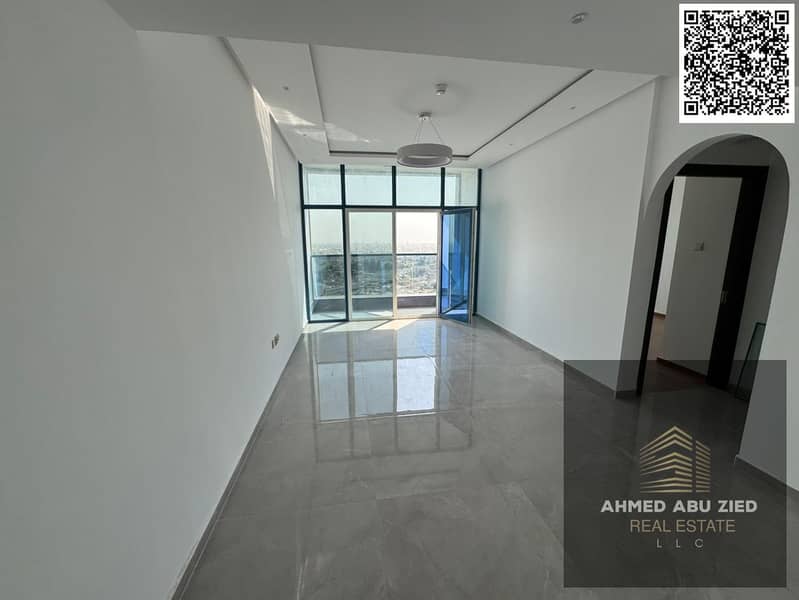 Brand-new 1BR in Al Nuaimiya 3, annual rent. Luxury finishes, prime lively area, master bedroom, 2 baths, open-view balcony, free parking.