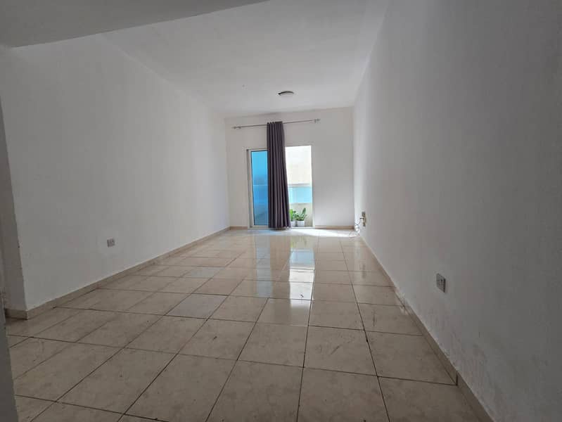 One bedroom and living room in Al Nuaimiya with a balcony, large area, central air conditioning, family accommodation, free maintenance.