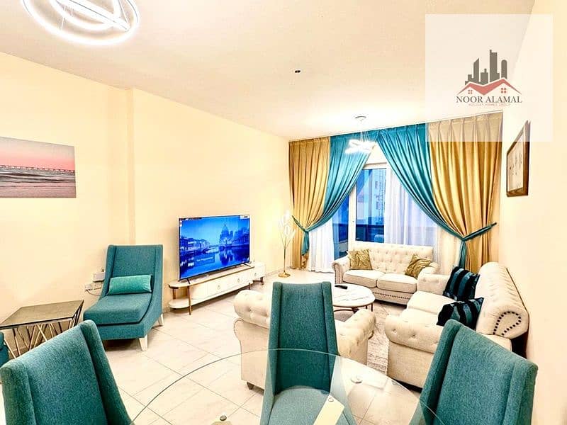 Sharjah, Al Taawun area: One bedroom, living room, kitchen, two bathrooms, and a balcony overlooking the lake. Price: 4900 AED including internet.