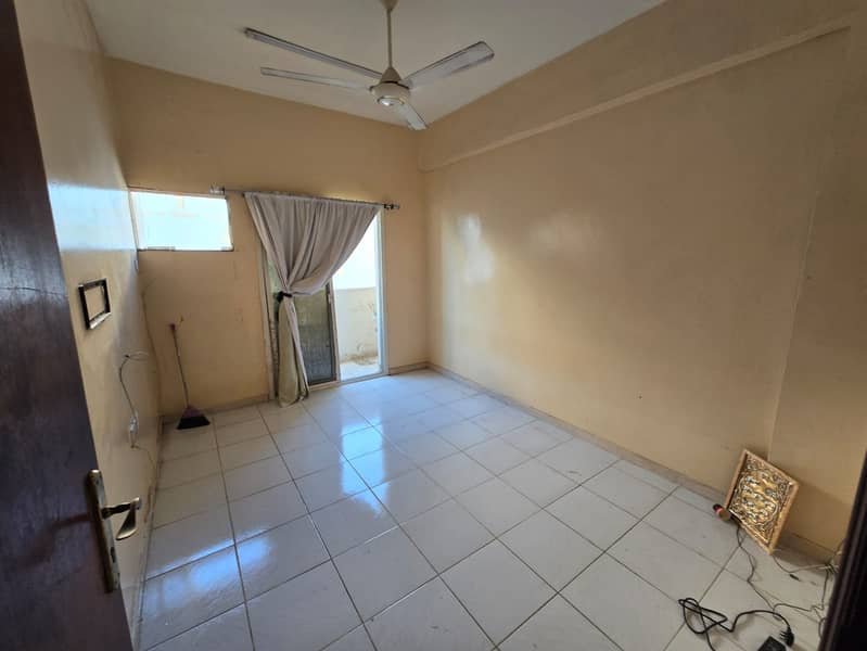 2-bedroom apartment in Al Rawdha 3 on Sheikh Ammar Street, 2 bathrooms and 2 balconies, spacious layout, prime location