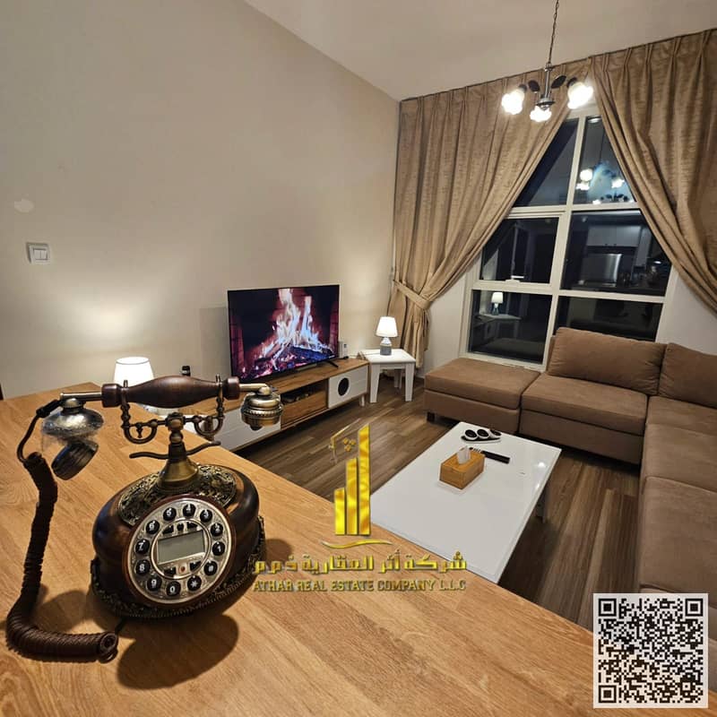Luxury apartment for monthly rent, one bedroom and a hall with an open view, fully furnished with elegant furniture and a fully equipped kitchen