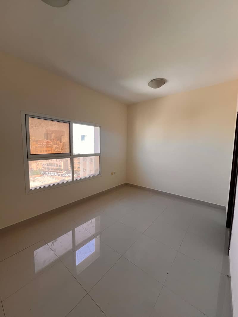 For annual rent: Studio apartment with separate kitchen, central air conditioning, and spacious areas in Al Nuaimiya 3.