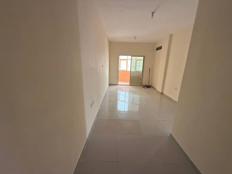 Annual 1 bedroom and living room for rent in Al Jurf 2 Ajman on the main road opposite Nesto and Emirates Markets prime location large space with open