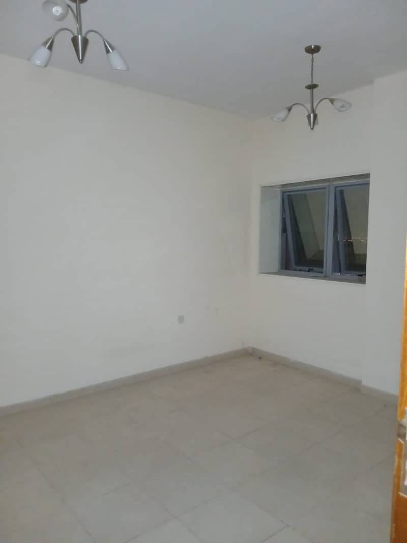 Spacious and clean room and living room in Al Nuaimiya 1. Excellent location with comprehensive services.