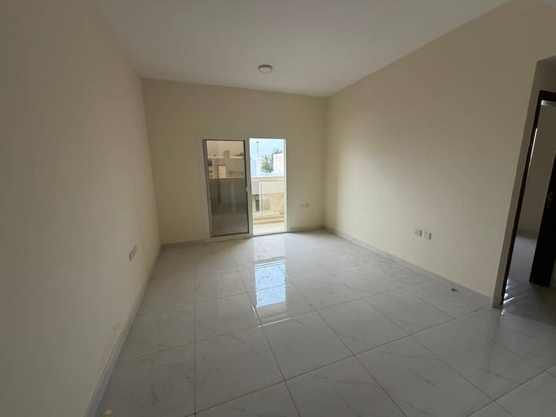 1 bedroom and living room for annual rent in Al Naeemiyah 3 Ajman bathroom balcony central AC spacious prime location behind Al Safeer opposite Sharja