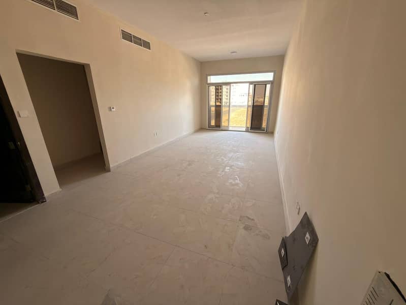For annual rent in Al Jurf 3, Ajman, first occupancy, in a prime location behind the Chinese market. Two bedrooms, a living room with a master bedroom