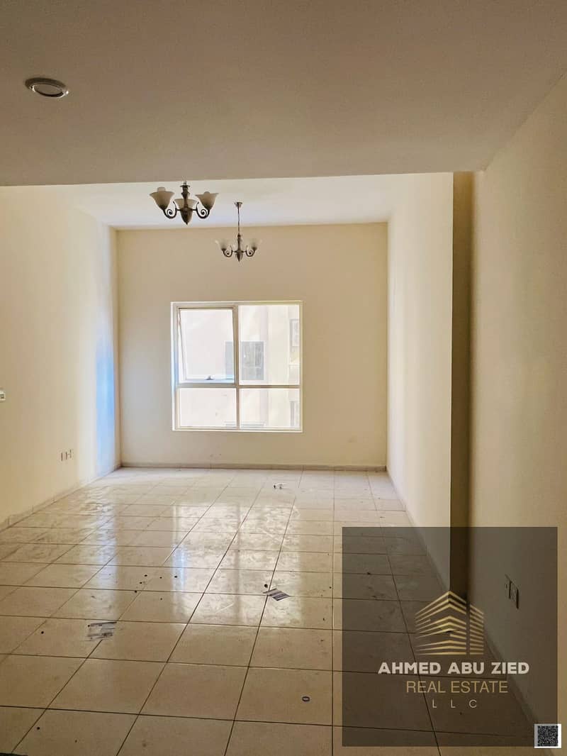 2BR apartment in Emirates City, Ajman, 2 baths, wardrobes, spacious hall, central AC, free maintenance, quiet & clean, on MBZ Road