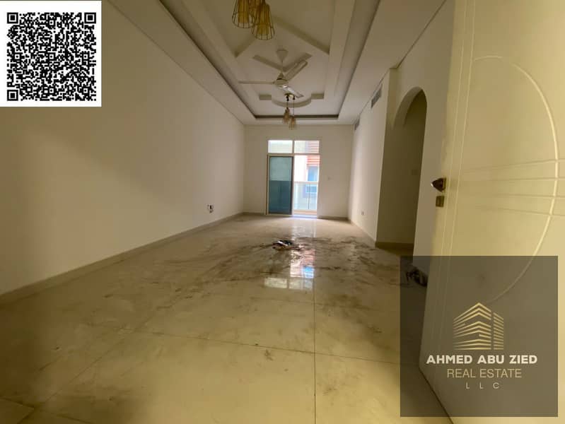 Two bedrooms and a living room with two bathrooms and a distinctive balcony, with built-in wardrobes, in Al Muwaihat 3 area, near Al Shuwaifat Interna