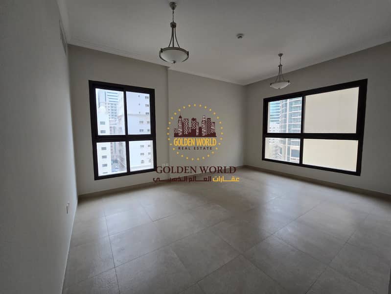 Modern two bedroom apartment with living room in Al Khan Sharjah featuring master room three bathrooms built in wardrobes and private parking prime fa