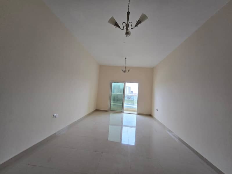 1bhk in Al Rawda 2 for annual rent on Sheikh Ammar Street in Ajman, Master bedroom and living room, 2 bathrooms, with central air conditioning,