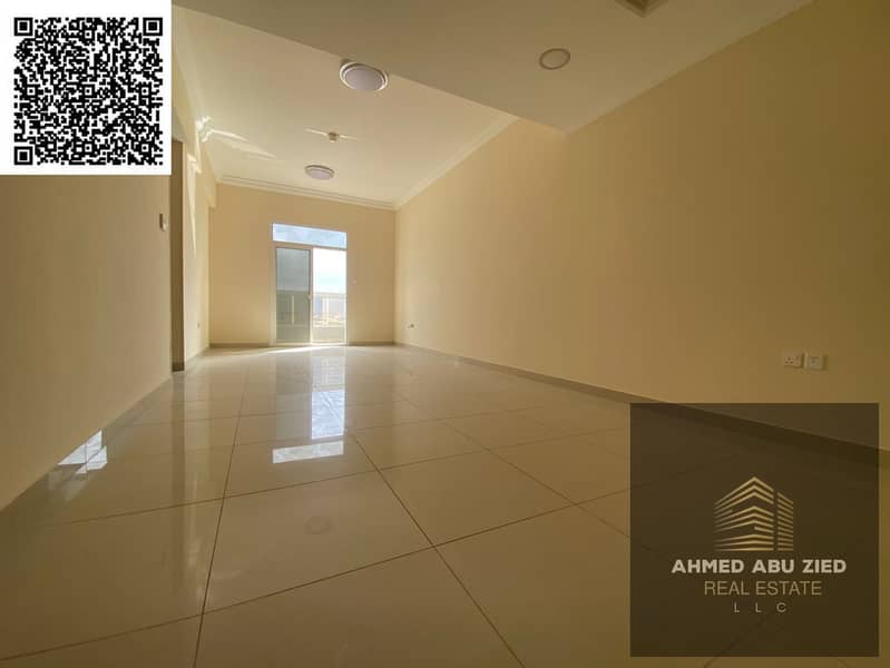 Two bedrooms and a living room, first occupancy, with a distinctive balcony offering an open view, two bathrooms, and a prime location in Al Jurf 3 ar