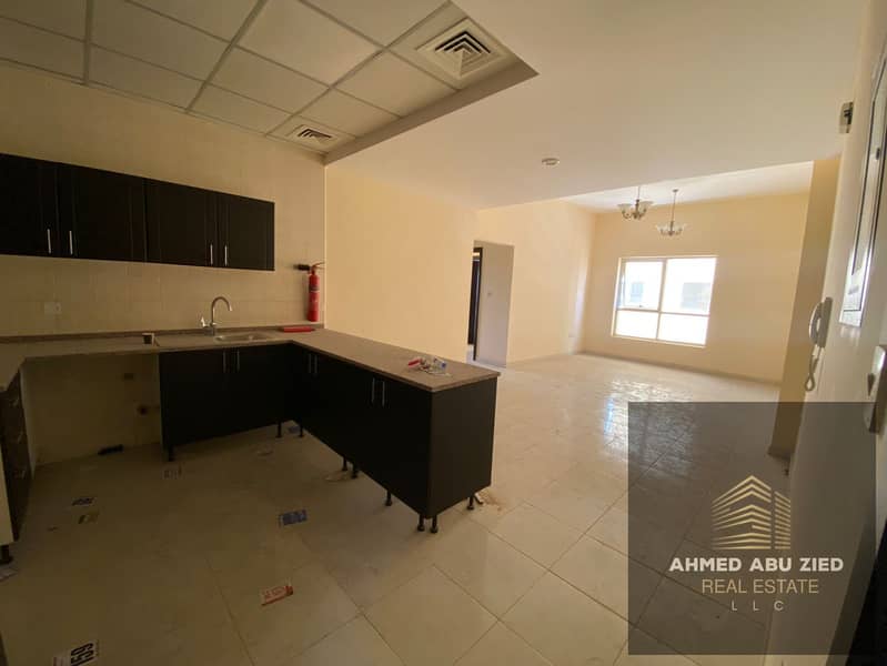 2BR + hall apartment in Ajman, 2 baths, spacious hall, balcony, central AC, gym & pool, continuous maintenance, quiet & clean, prime MBZ Road location