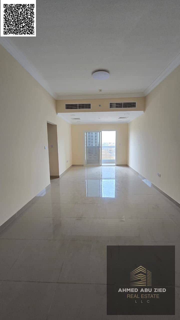 Two bedrooms, a living room, three bathrooms, and a balcony in a new building. First occupancy. Includes a fully equipped kitchen. Located in Al Jurf