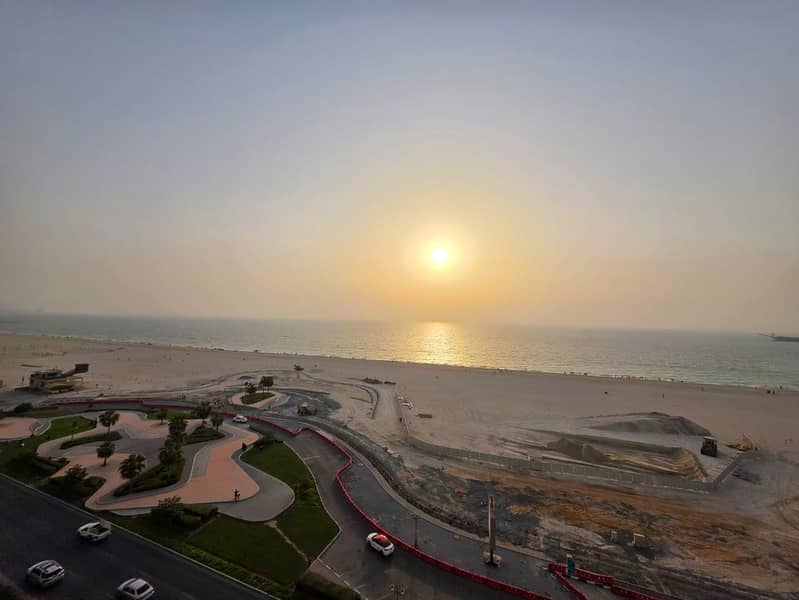 3 bedroom apartment with living room for annual rent on Ajman Corniche direct sea view large space high-end finishing 3 bathrooms balcony prime locati