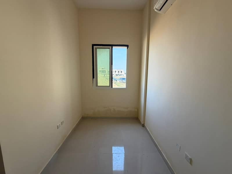 Studio for rent in Al Aliyah, separate kitchen, spacious, prime location next to Sheikh Mohammed Bin Zayed Road, AED 20k/4 payments.