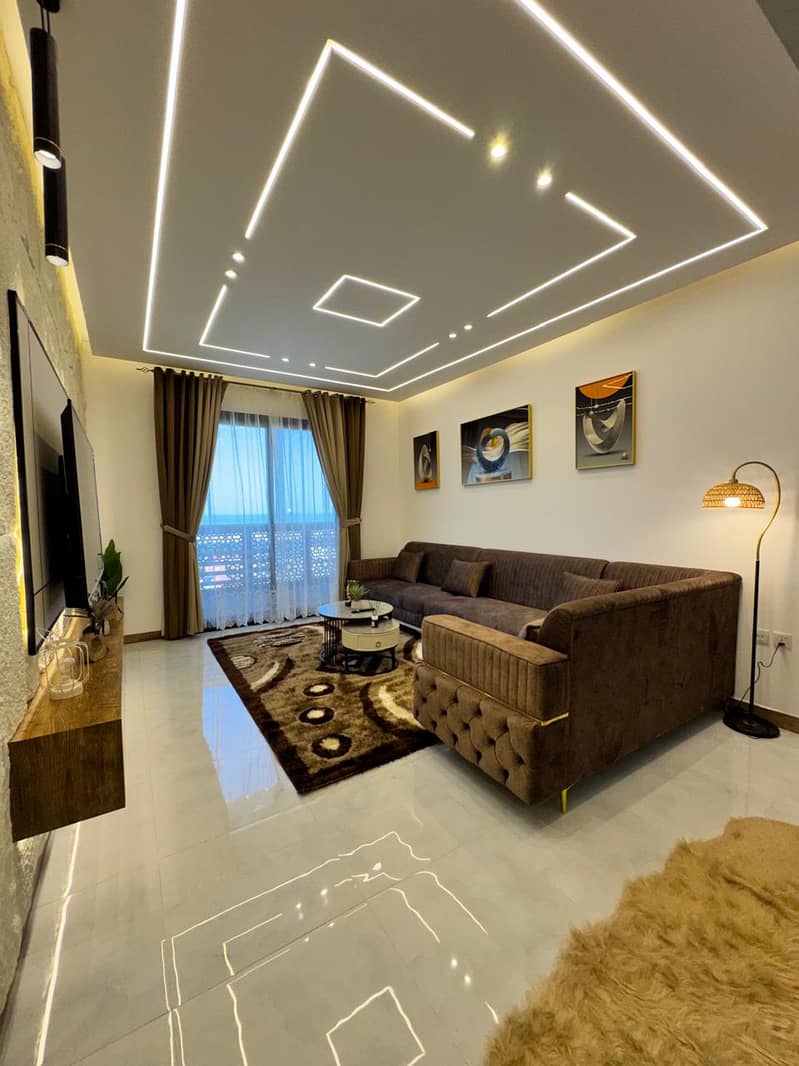 Furnished 2BR apartment in Ajman Marina Walk, full sea view, bills, internet, parking & gym included.