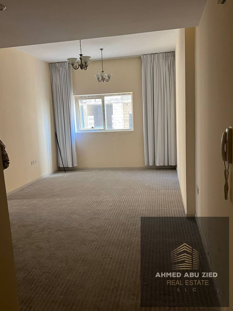 Two bedrooms and a living room, first occupancy, for annual rent in Emirates City on Sheikh Mohammed Bin Zayed Road. Prime location with open views an