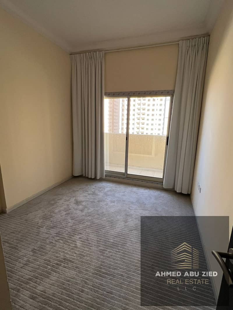 One bedroom and living room, first occupancy, for annual rent in Emirates City on Sheikh Mohammed Bin Zayed Road, prime location with open views and i