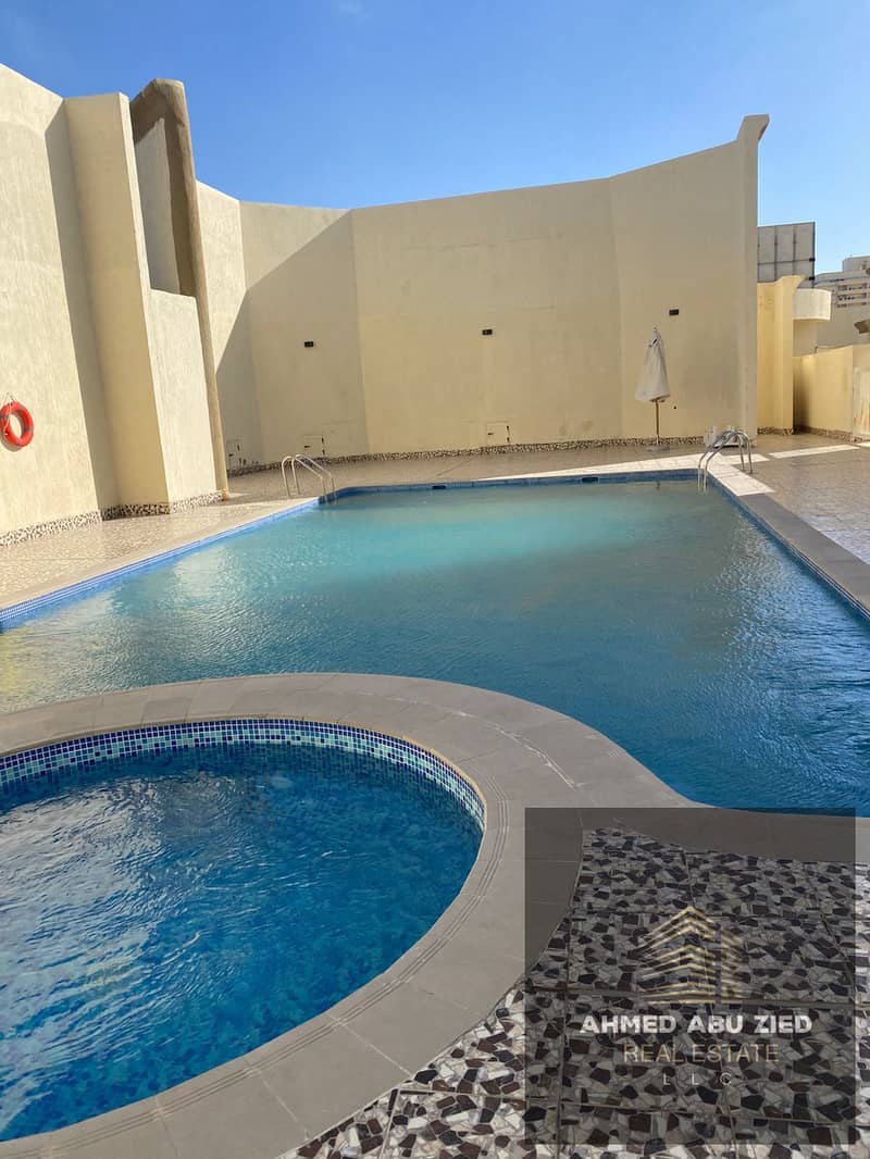 Two bedrooms and a living room for annual rent in Emirates City. Prime location with integrated services such as a gym and swimming pool. Practical de