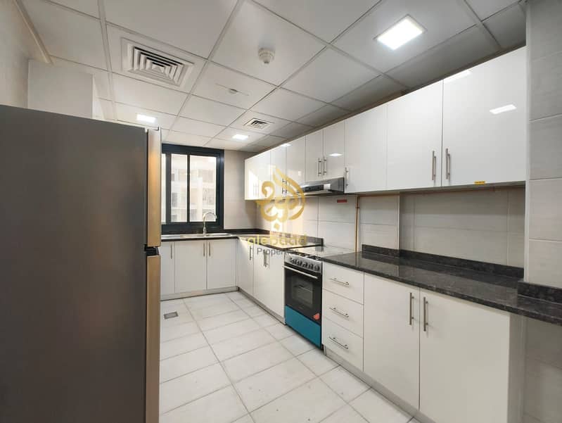 2 Bedroom Apartment | White Rose Building JVC | Balcony & City View - Image 12