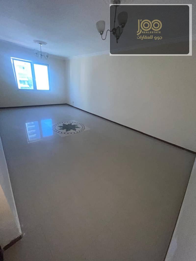 2-bedroom apartment with living room in Al Naeemiya 3, Khalifa Street, 2 bathrooms, balcony, central AC, spacious, AED 39–45k in 4–5 installments, AED