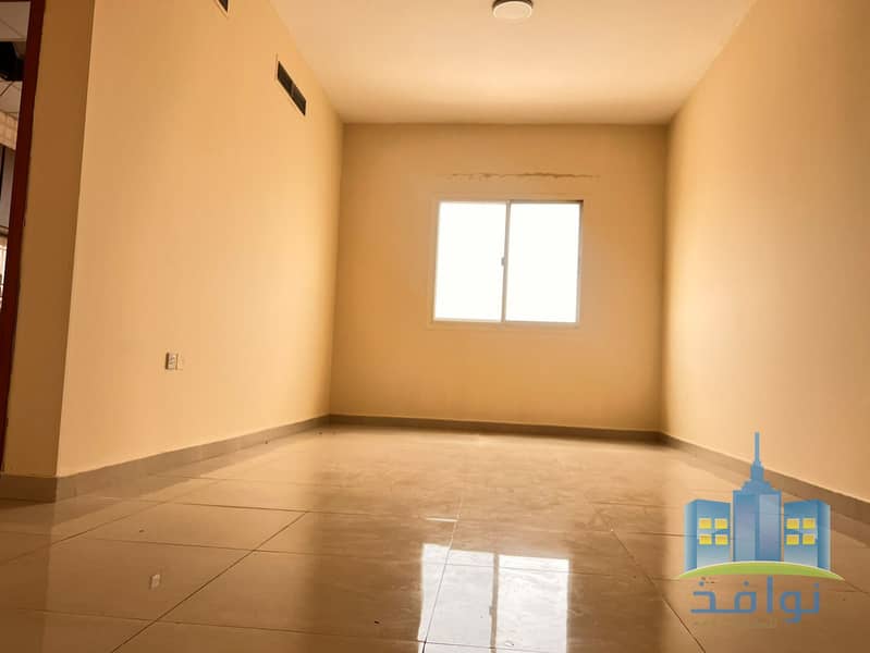 A room and a second living room in a spacious area.