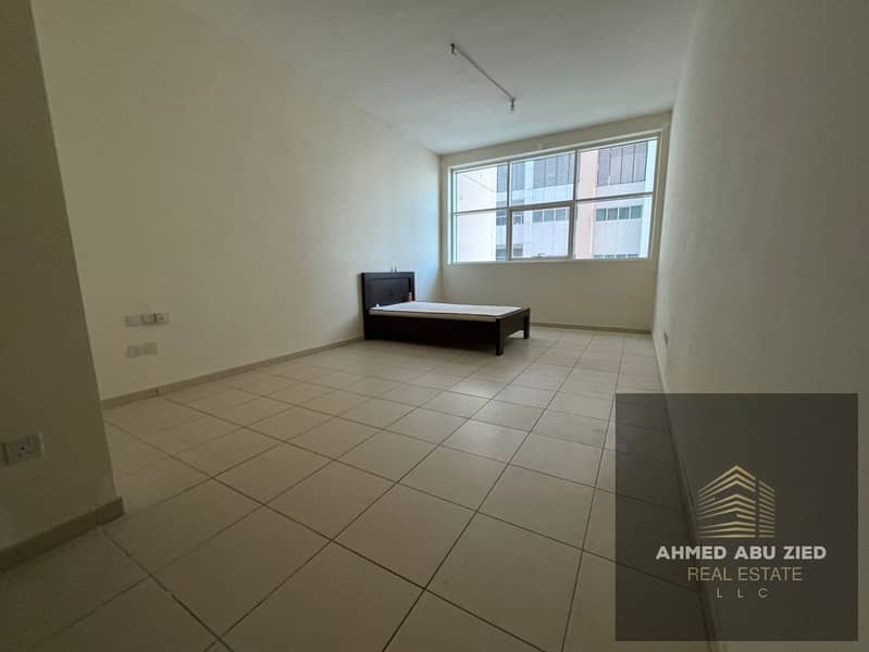 One bedroom and living room for annual rent in Ajman One Towers, Al Rashidiya 3, with a large area, modern design, balcony and open view.