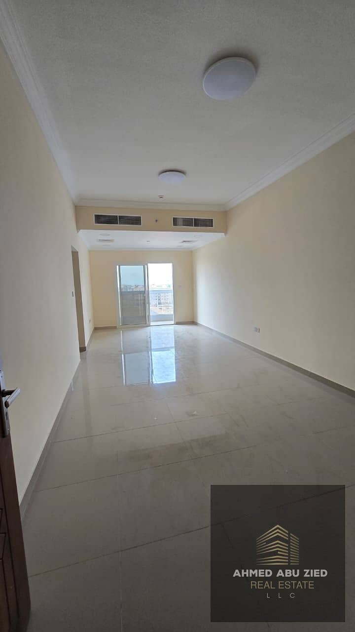 Brand new first-occupancy apartment for annual rent in Al Jurf 3, Ajman. 2 bedrooms, 3 bathrooms, storage room, open-view balcony, built-in wardrobes,