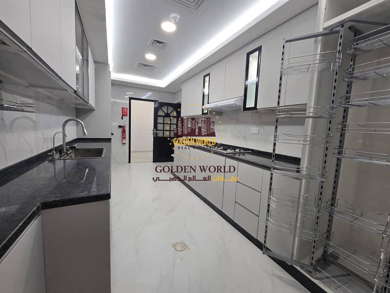 Spacious three bedroom apartment with sea view in Al Taawun Sharjah featuring master room four bathrooms modern kitchen balcony maid room laundry and