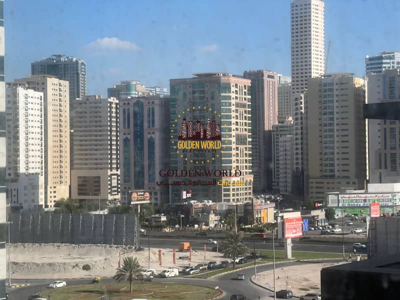 Two bedroom apartment with balcony in Al Taawun Sharjah featuring two bathrooms clean building private parking and practical layout close to all servi